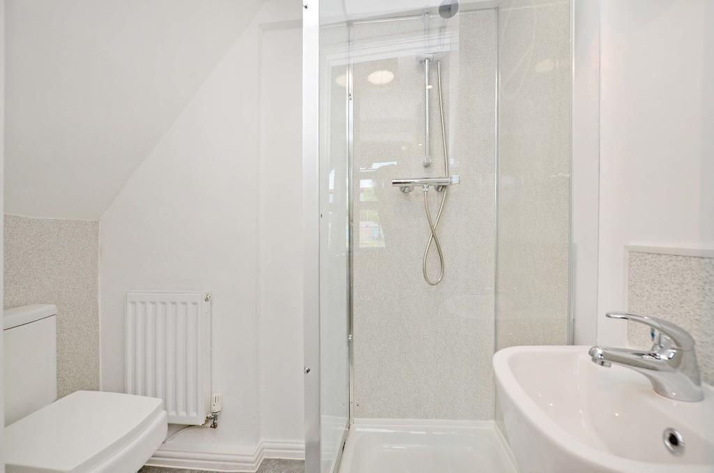 Bright and modern bathroom featuring a spacious...