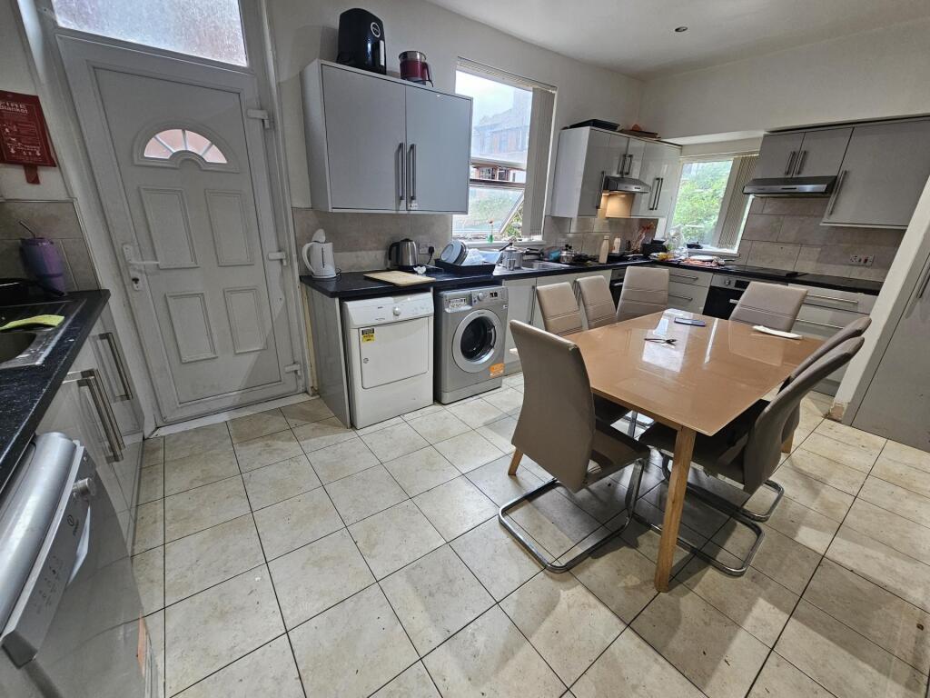 Bright and spacious kitchen area with modern ap...