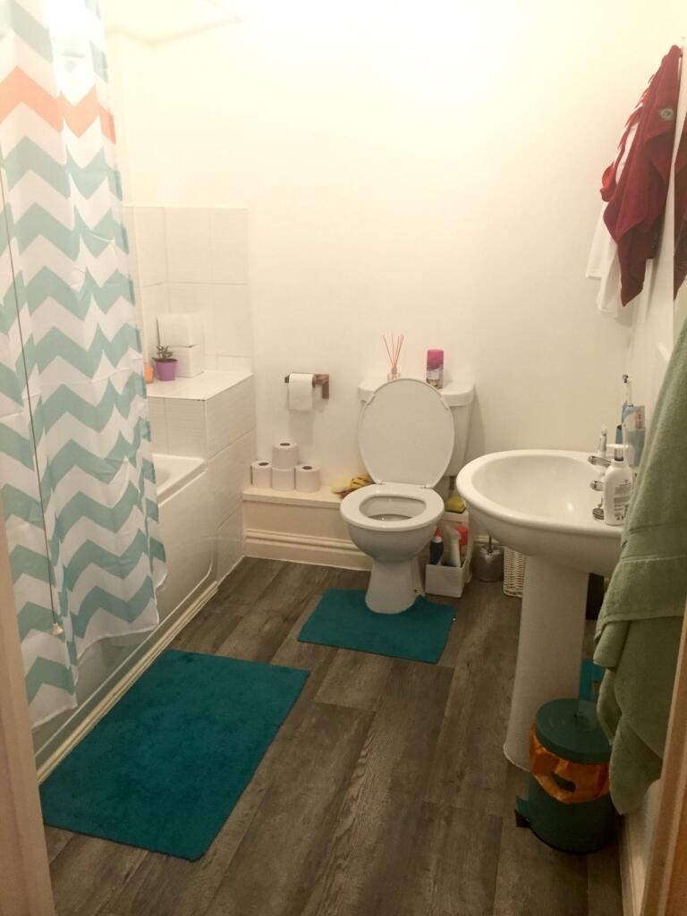 Bright and clean bathroom with a modern shower ...