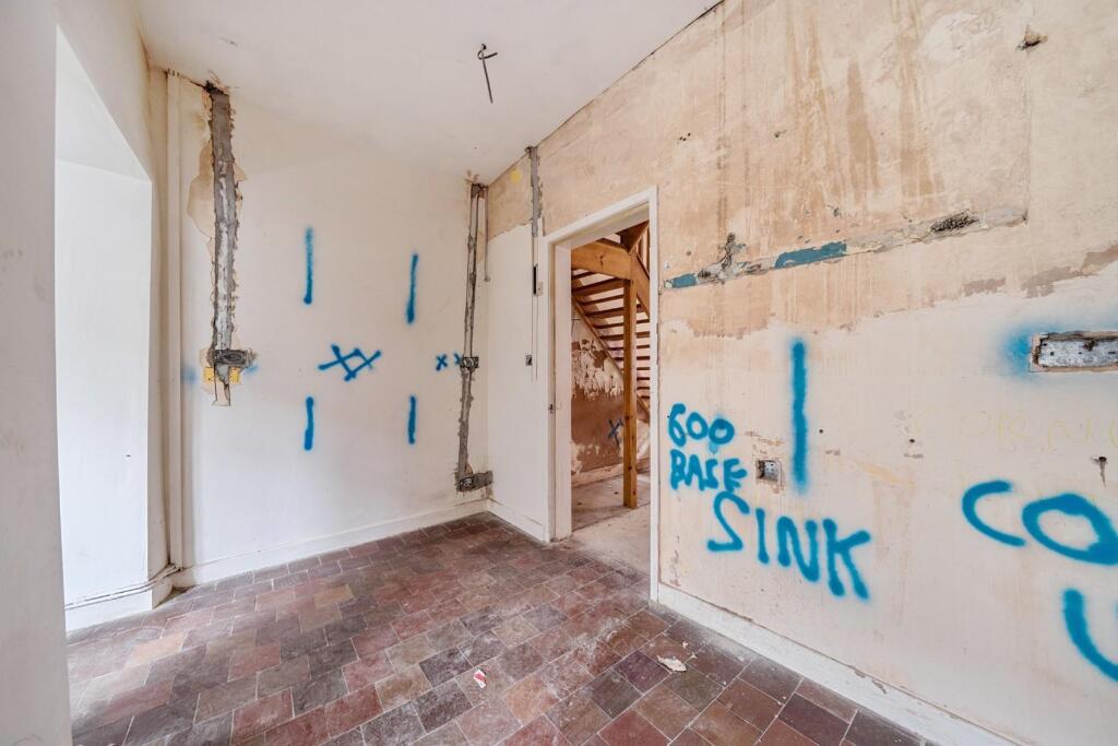 Kitchen with entrance to front room.jpg