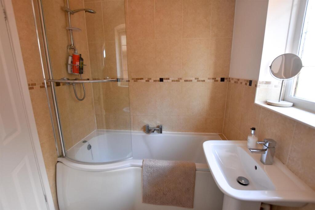 FAMILY BATHROOM WITH SHOWER OVER