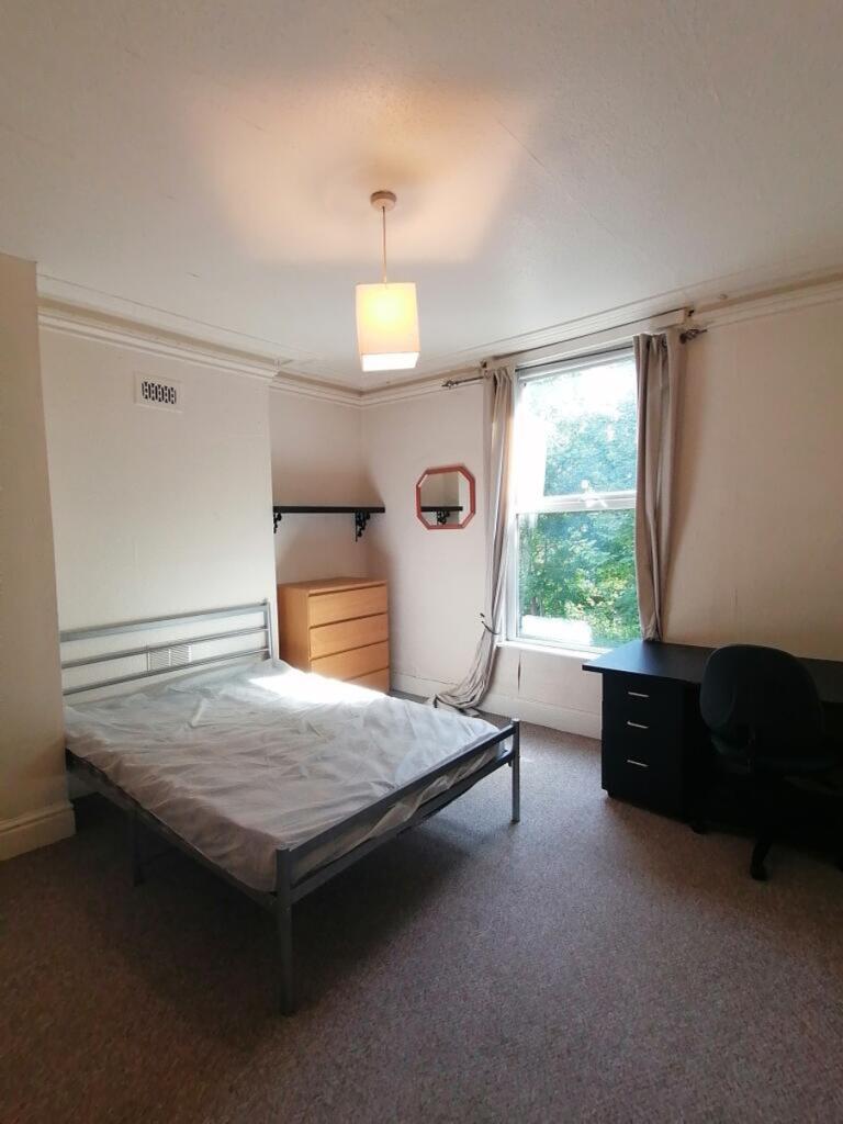Bright and inviting double bedroom featuring a ...