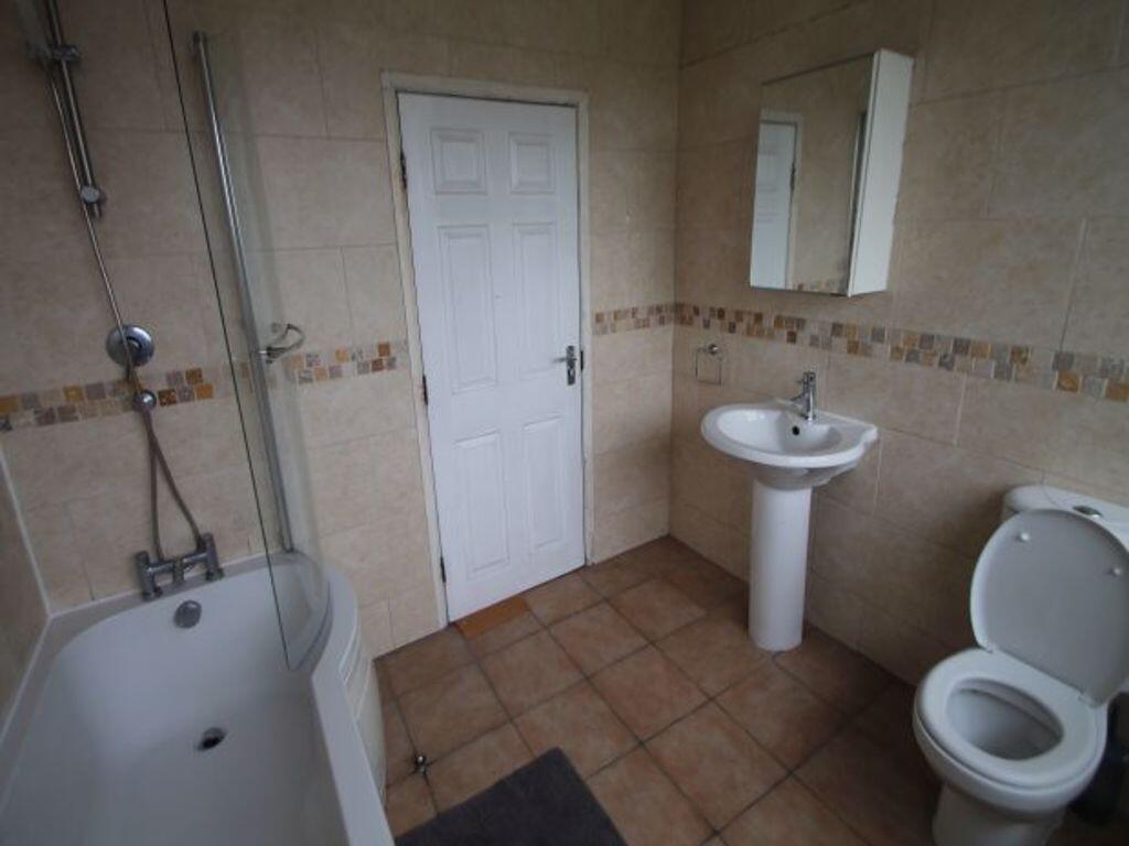 A clean and well-maintained bathroom featuring ...
