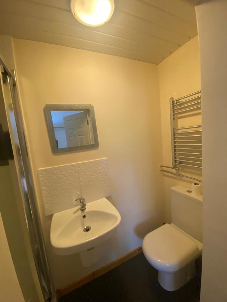 A well-maintained bathroom featuring modern ame...