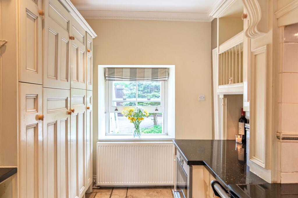 Triple cottage windows flooding the space with light