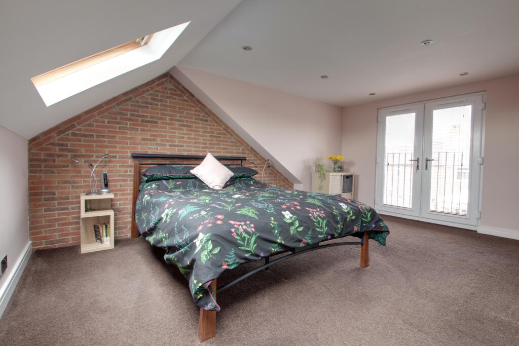 Loft bedroom with Juliet balcony