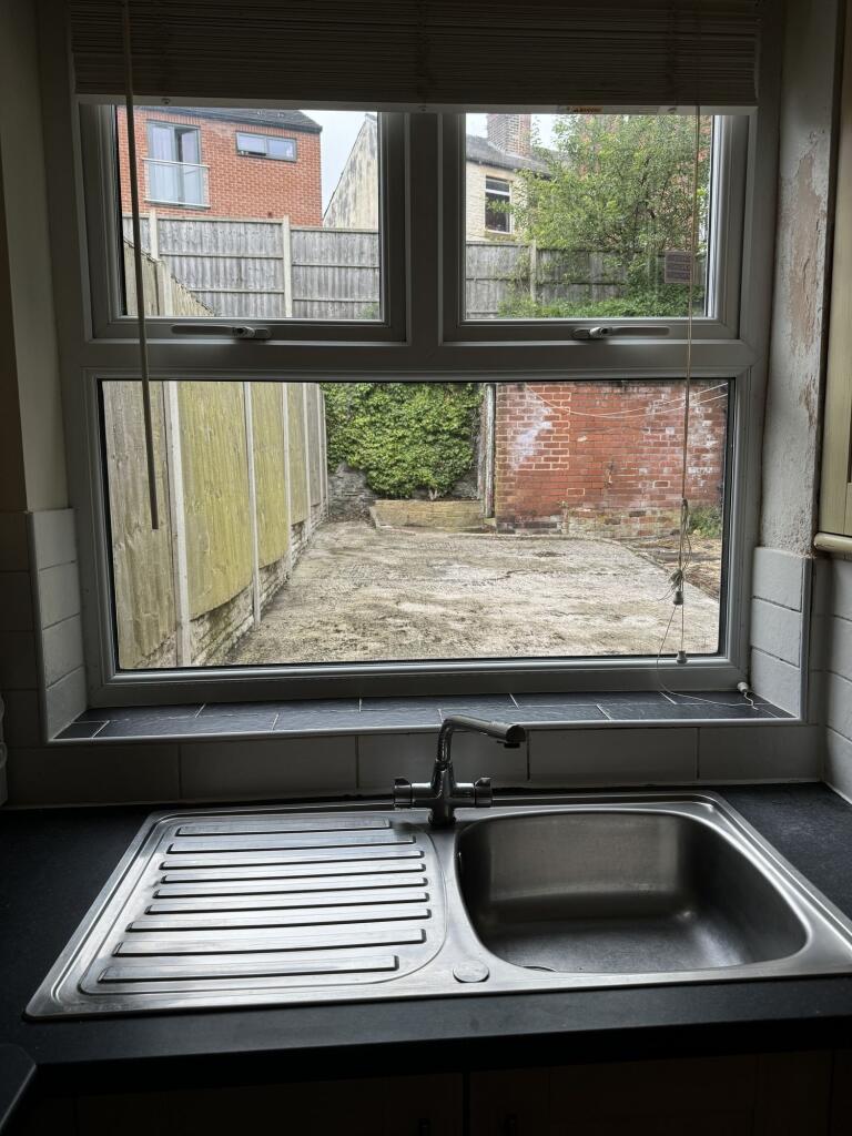 A functional kitchen featuring a stainless stee...