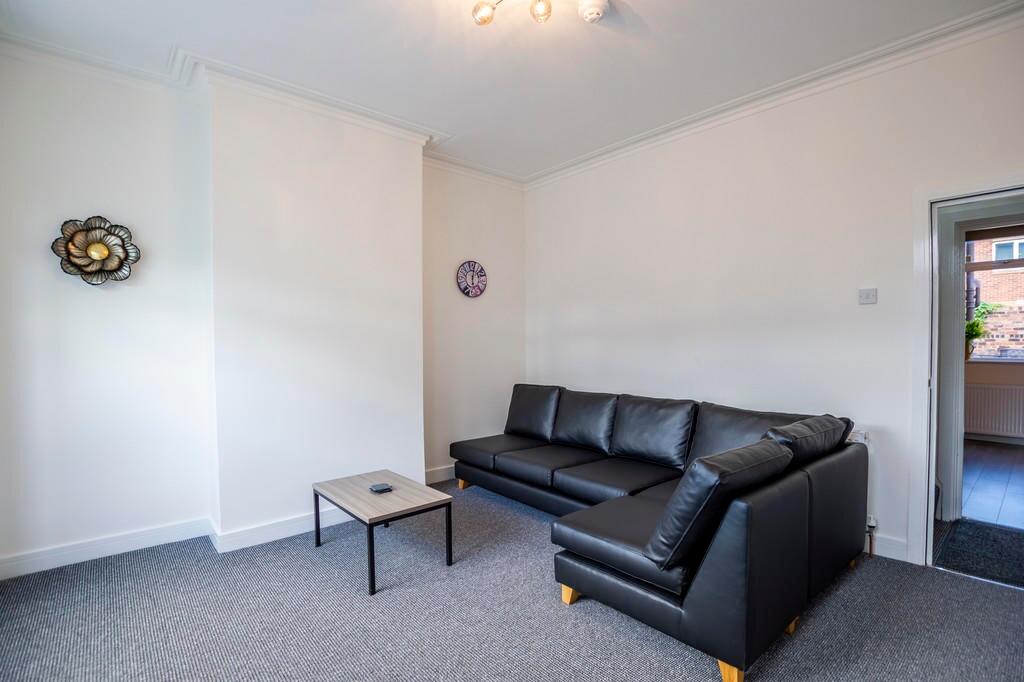 A neat and inviting living room featuring a mod...