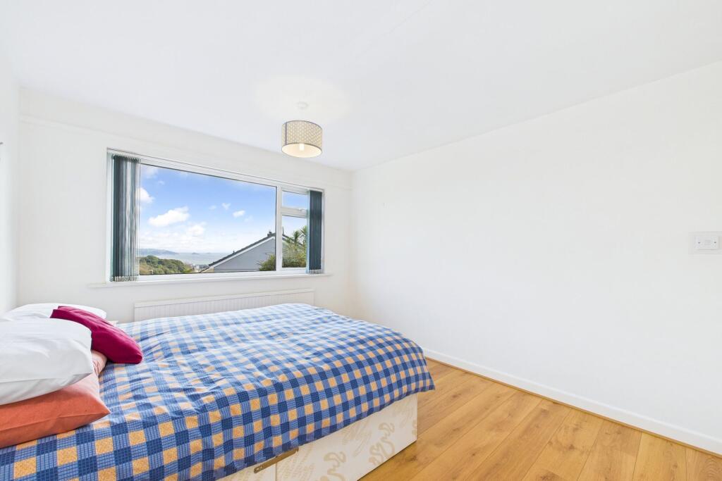 Bedroom two on ground floor with sea views