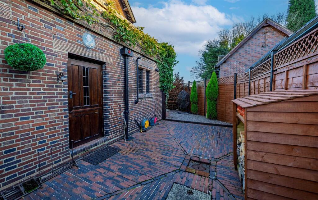 Right side elevation with historical plaque above 