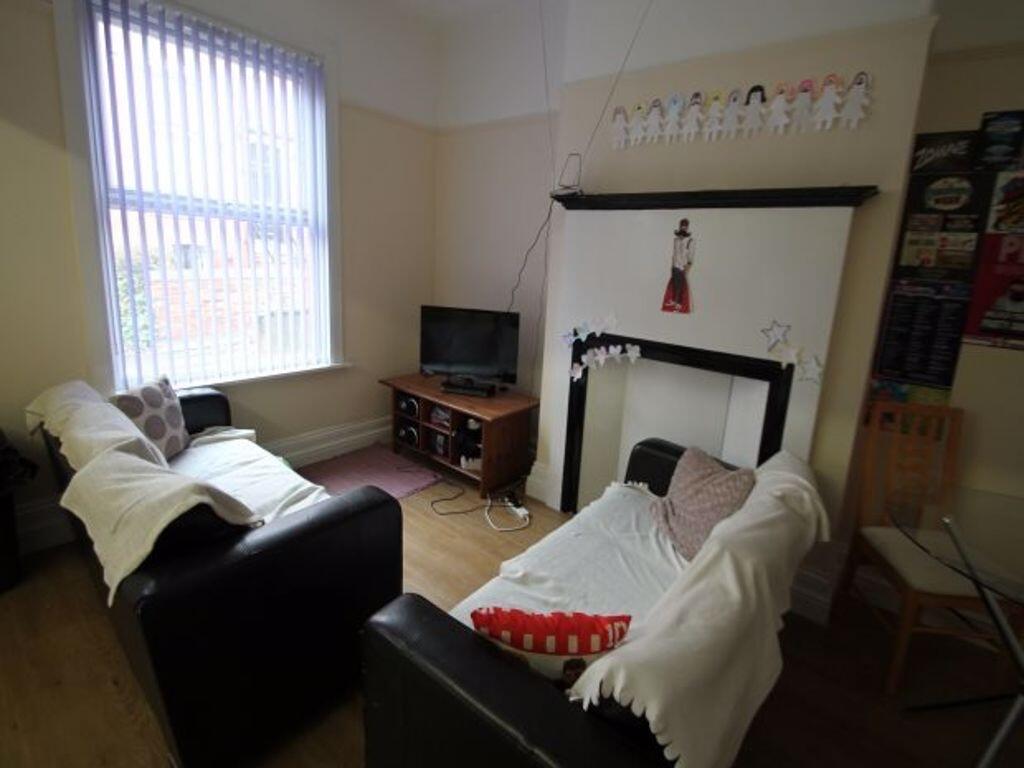 A cozy living room featuring a comfortable sofa...