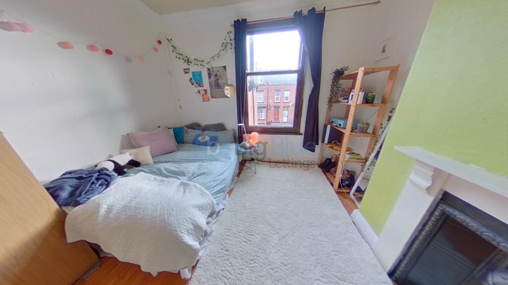A charming double bedroom featuring a cozy doub...