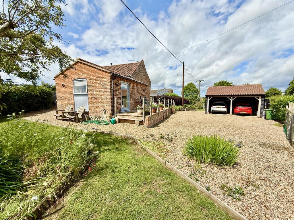 rear aspect and driveway