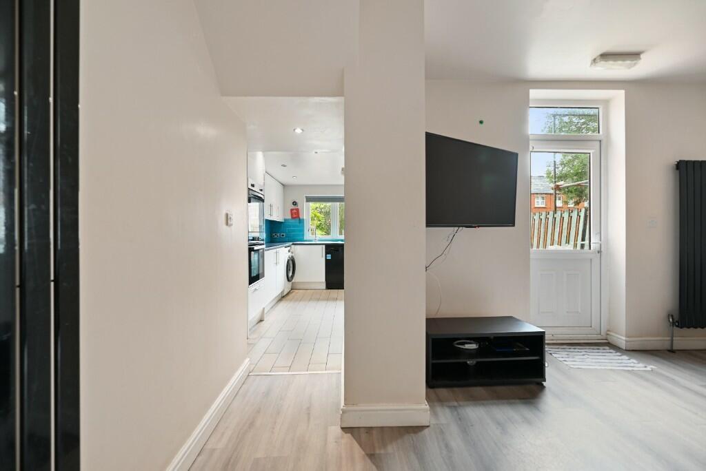 A bright and modern living space featuring ligh...