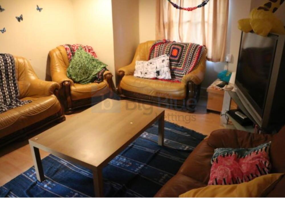 Cozy living room featuring comfortable leather ...