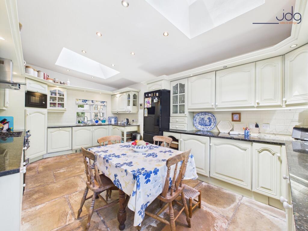 Kitchen with dining space and skylight