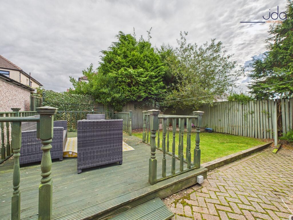 Spacious Garden with a mixture of lawn, decking and brick