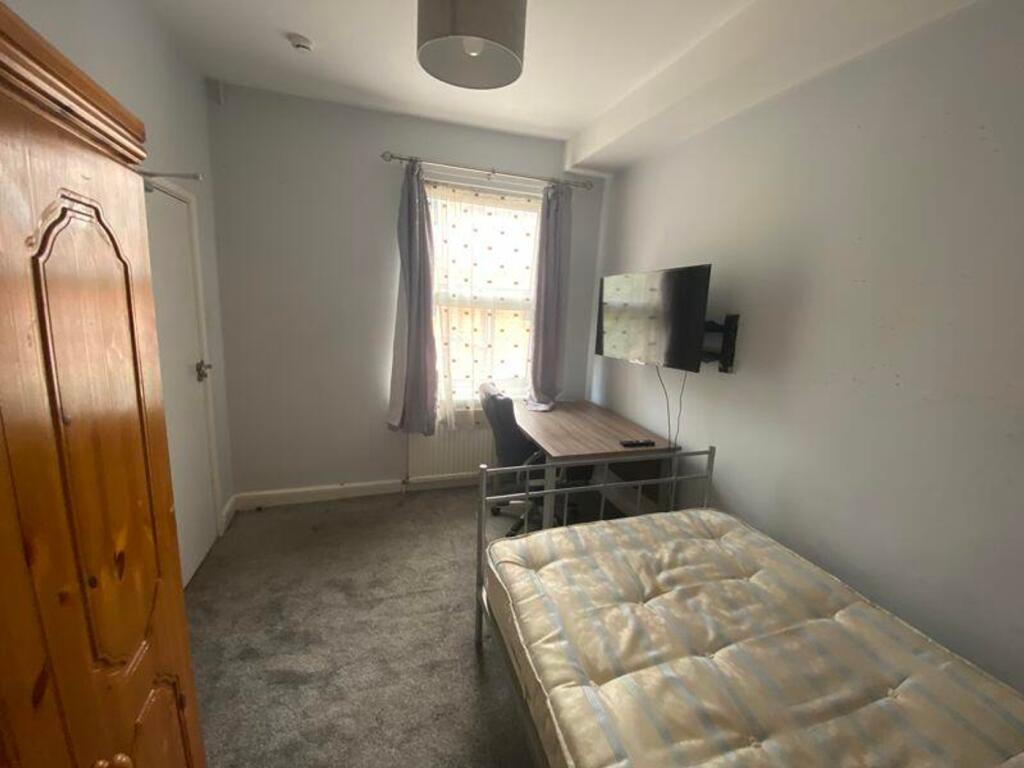 A bright and inviting double bedroom featuring ...