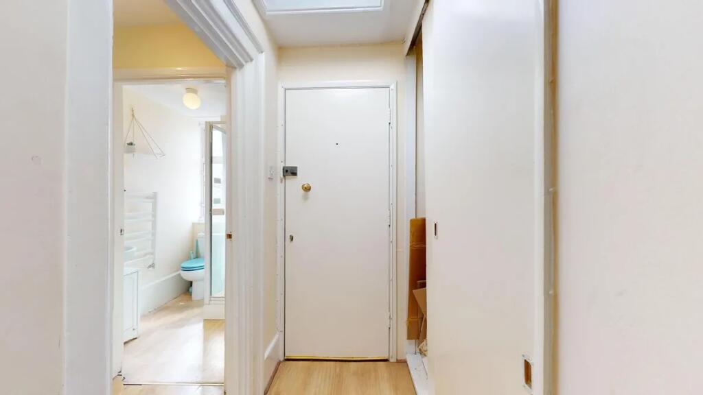 A clean and well-maintained hallway featuring l...