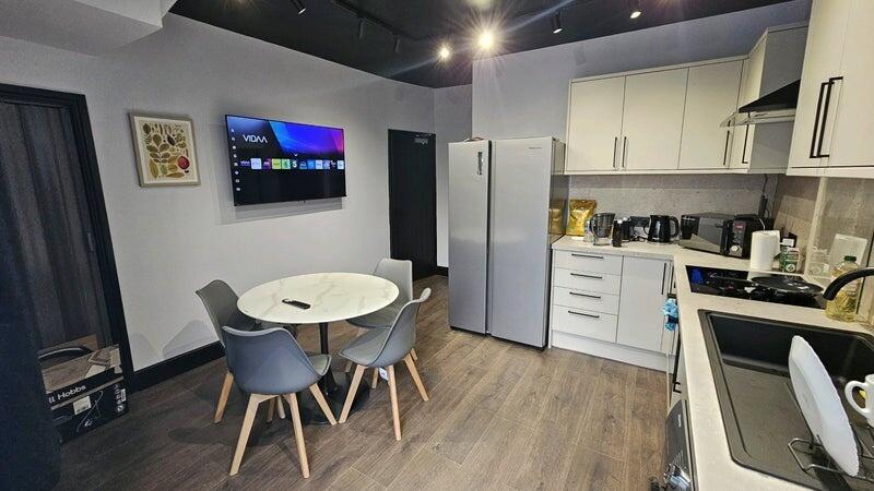 Modern and well-maintained kitchen featuring sl...