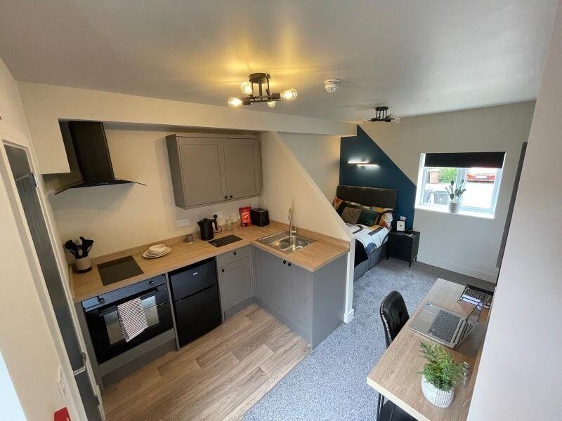 Bright and modern studio apartment featuring a ...