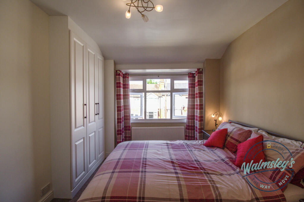 Bedroom one with bay &amp; built in wardrobes