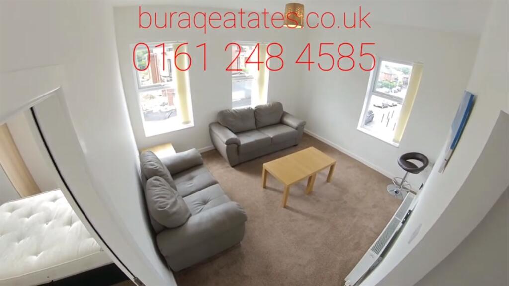 Bright, well-kept living room with two comforta...