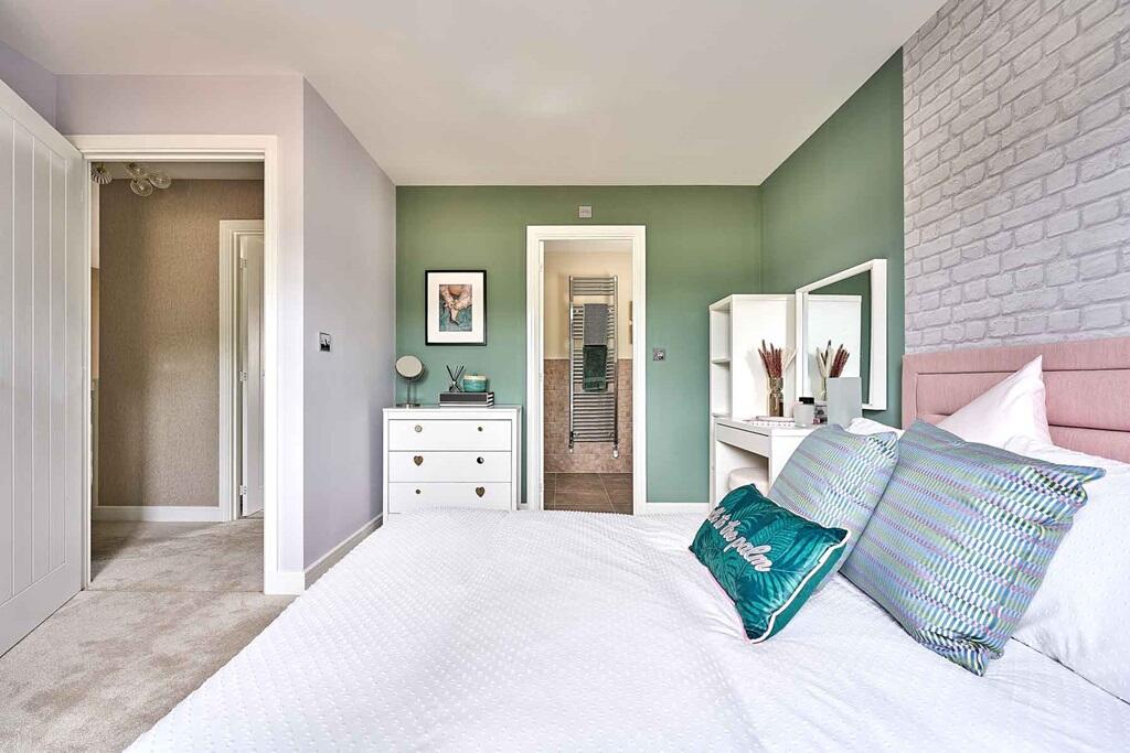 Bedroom 2 benefits from an en-suite