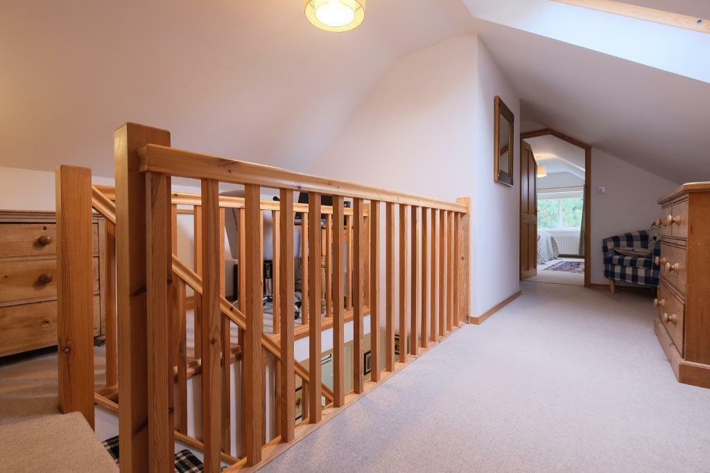 Bright landing leading to two bedrooms