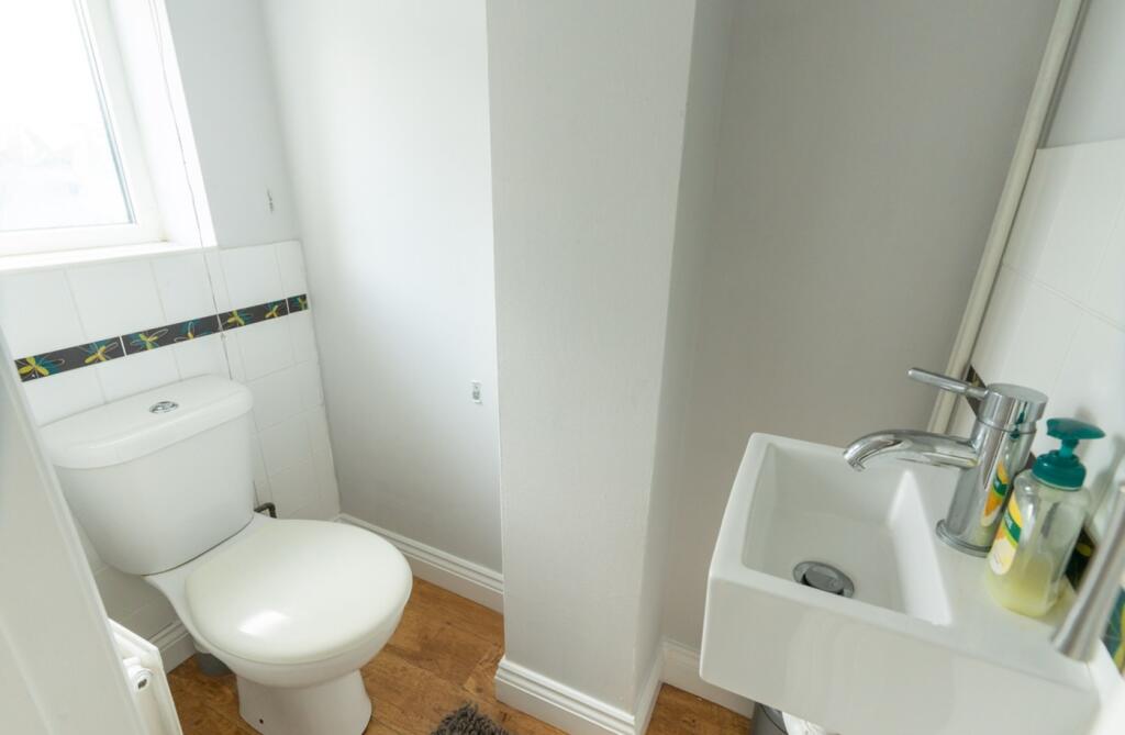 A tidy and well-maintained single toilet with n...