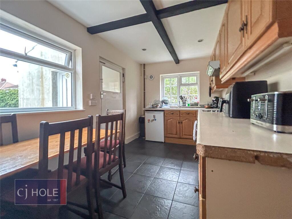 Bright and functional kitchen featuring natural...