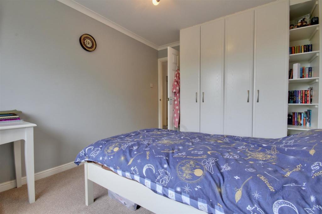 Bedroom Two with fitted wardrobes.