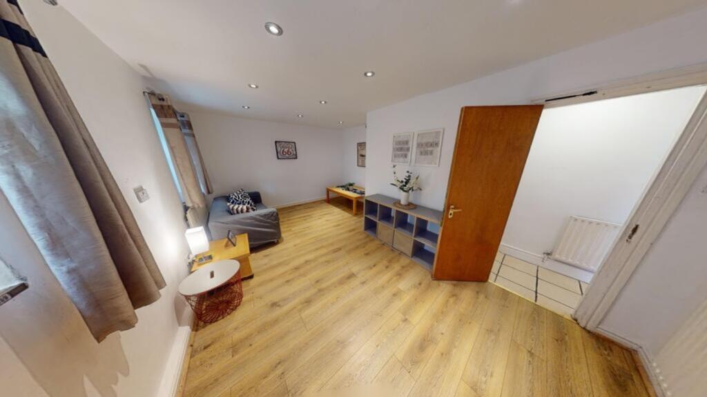 A spacious and inviting living room, perfect fo...