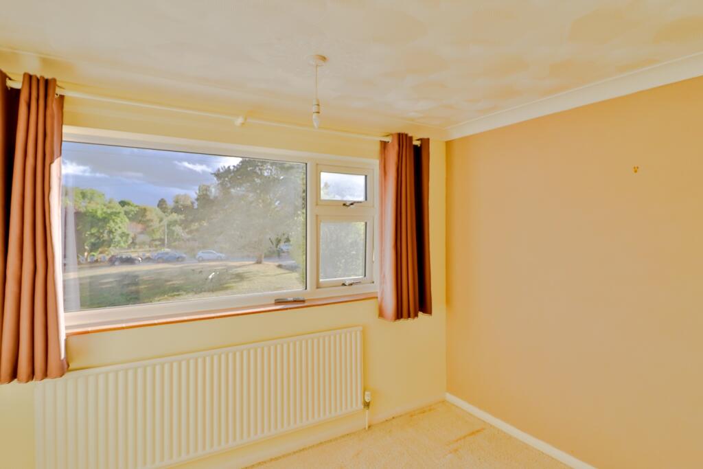Bedroom 1 with views over the Green