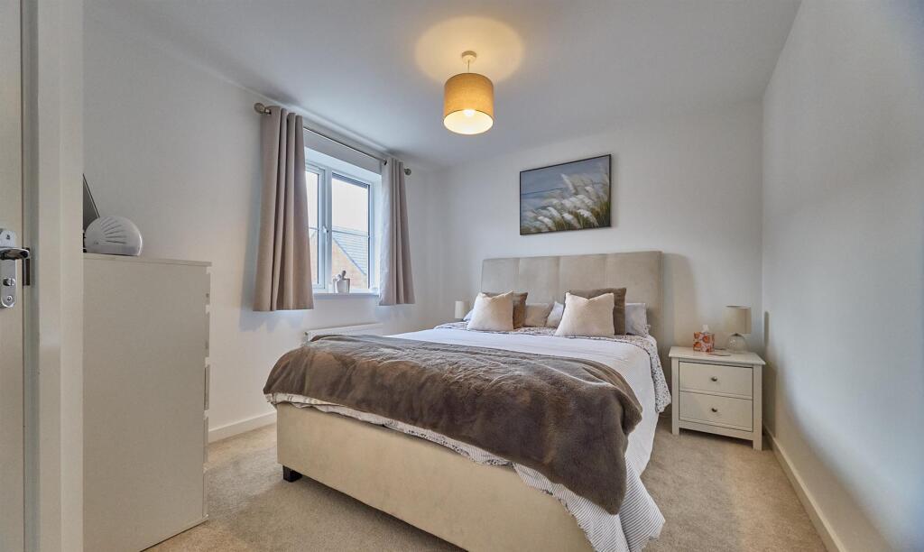 BEDROOM ONE TO FRONT