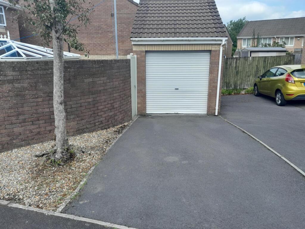 Detached garage to rear with parking
