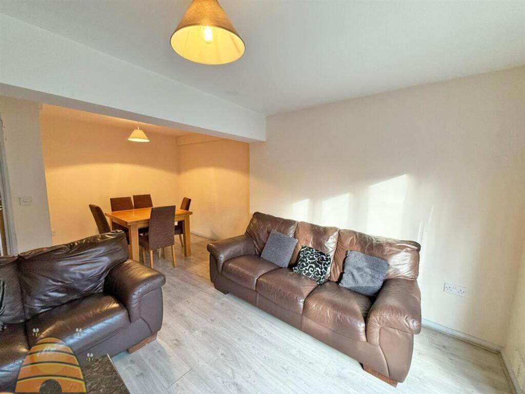 A bright and inviting large modern living room,...