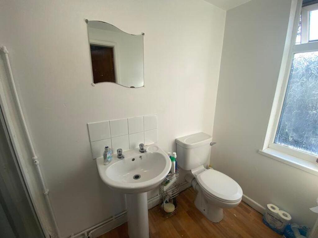 A clean and well-lit bathroom featuring modern ...