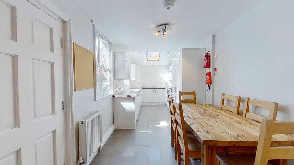 Bright, modern open-plan kitchen and dining are...