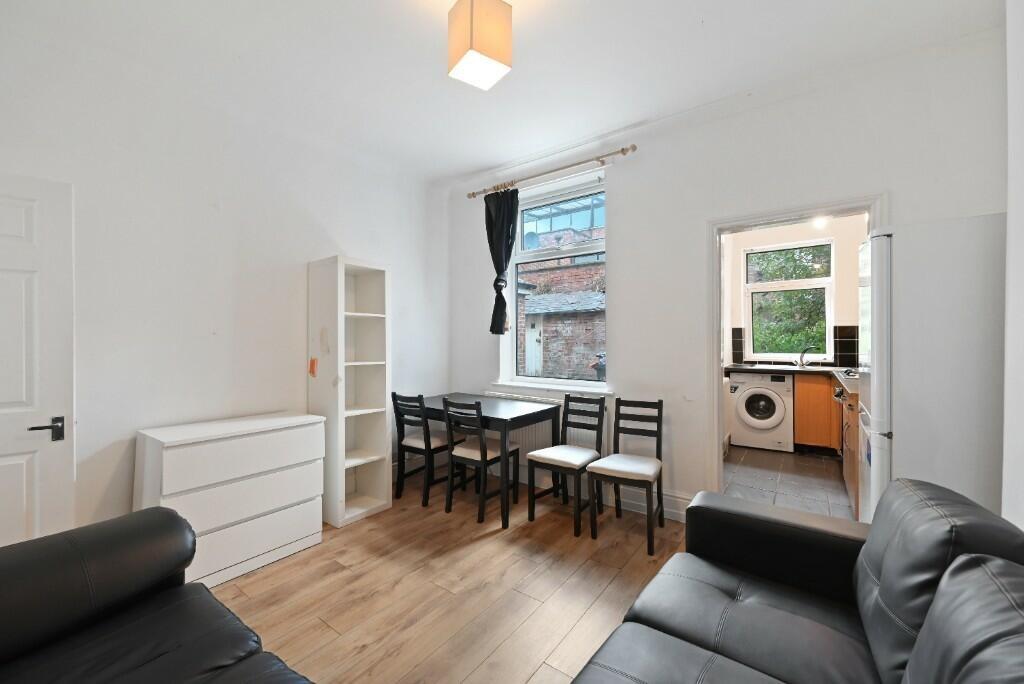 Bright and tidy living room with natural light ...