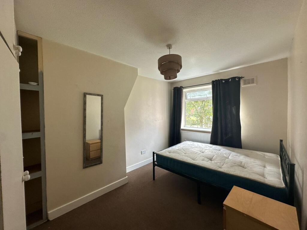 Bright and cozy double bedroom featuring a larg...