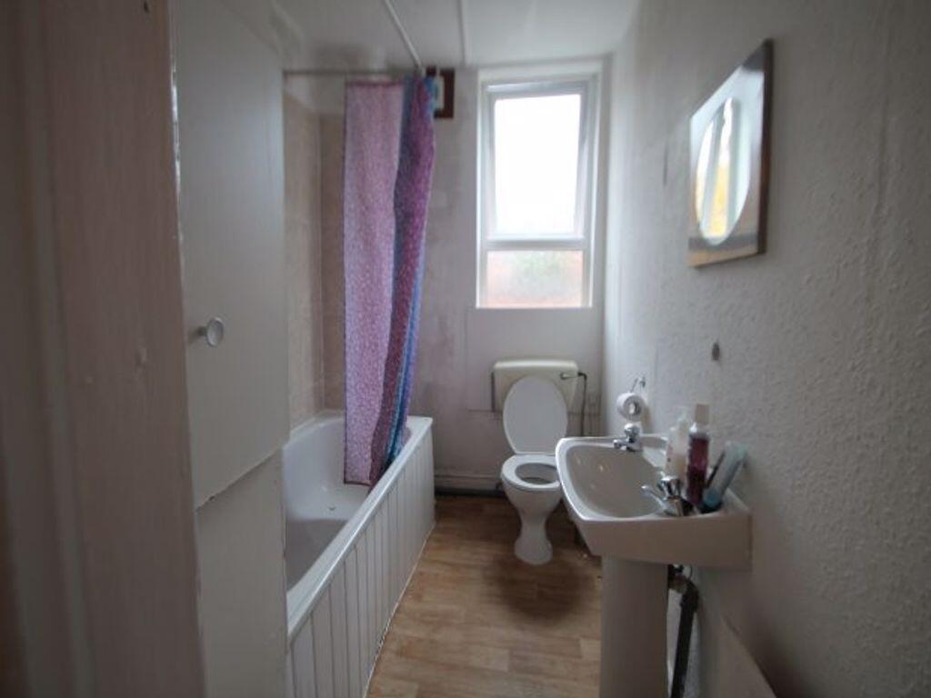 A clean and well-maintained bathroom with a bat...