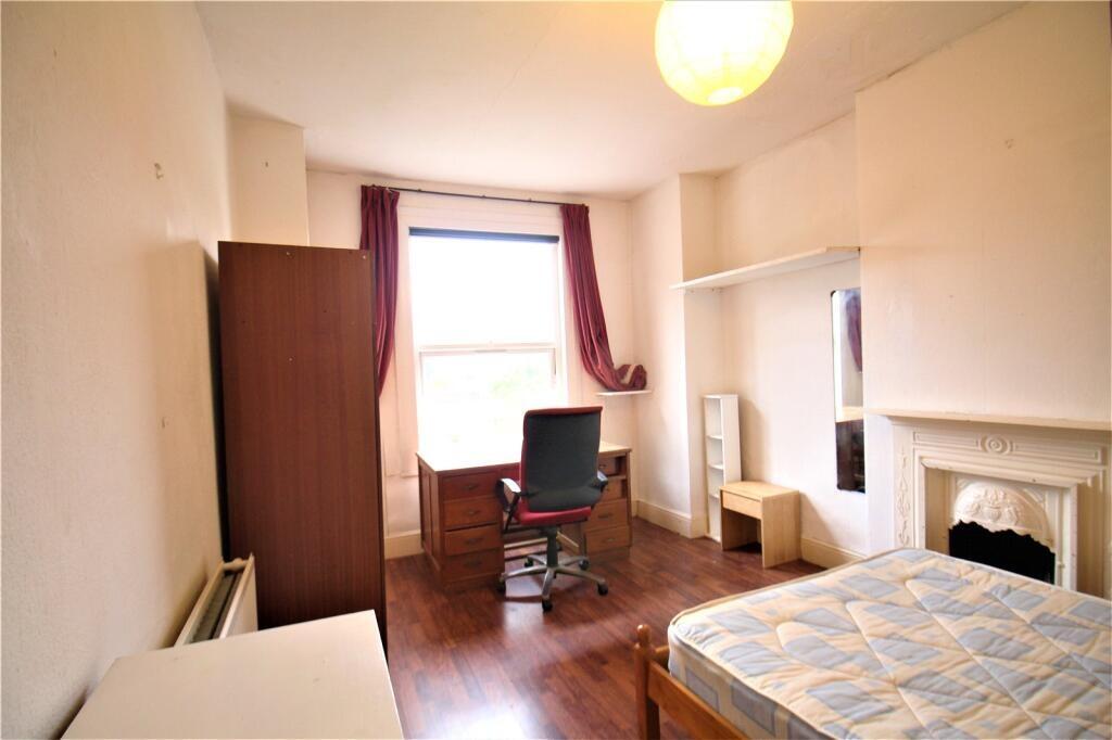 Bright and spacious master bedroom featuring a ...