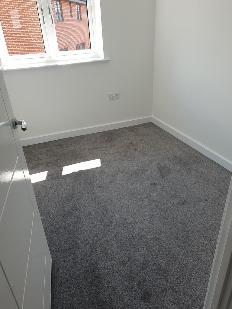 A bright and inviting double bedroom featuring ...