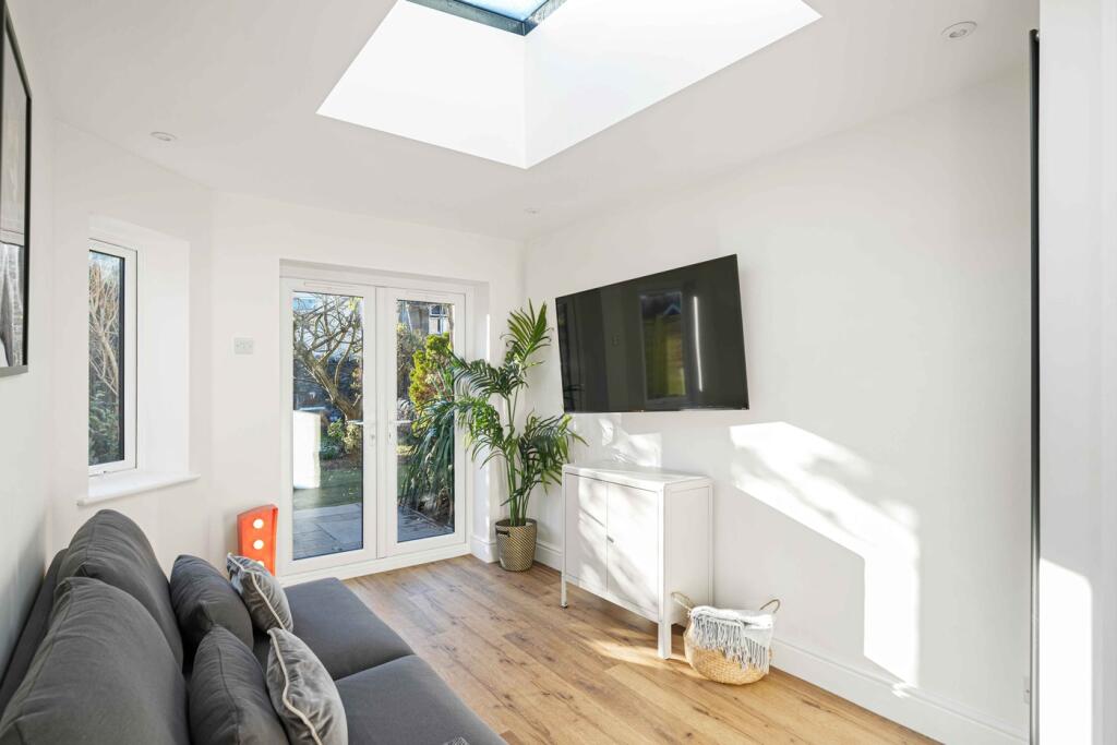 A bright and spacious modern living room featur...