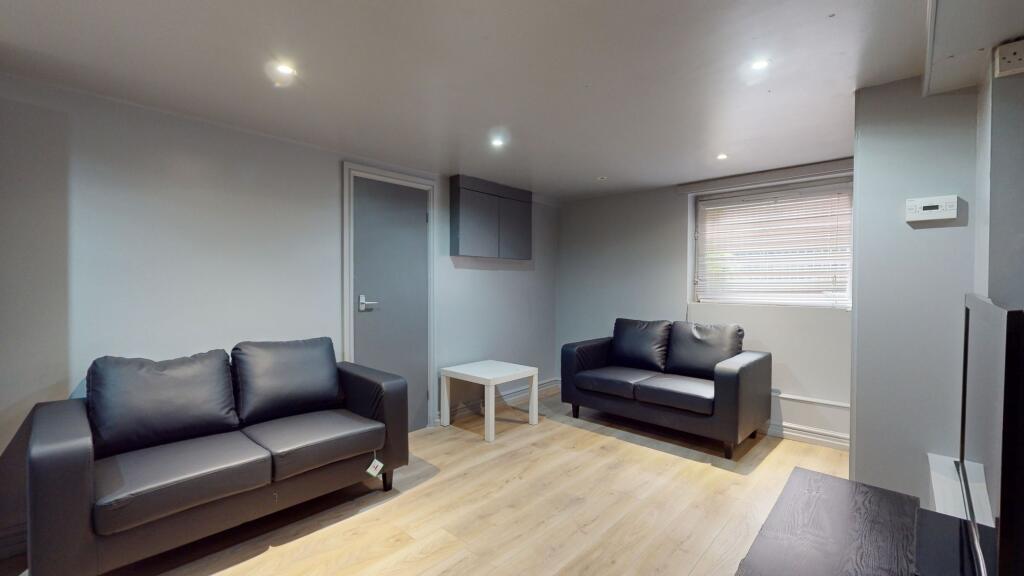 Modern and inviting living room with two comfor...