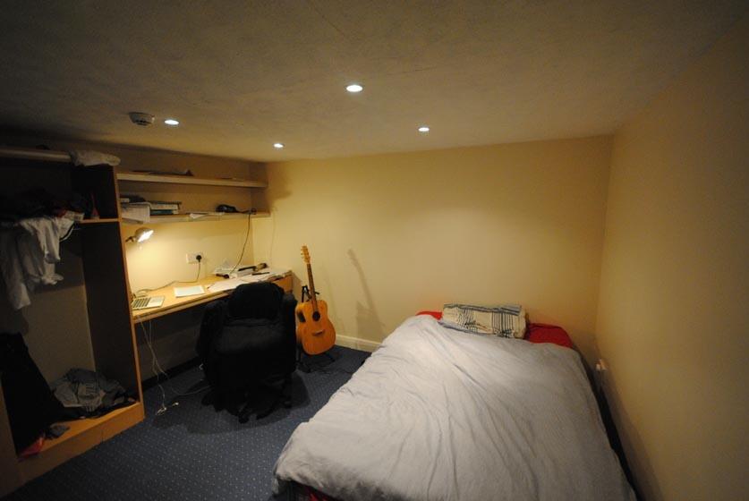 A cozy, well-maintained bedroom featuring a com...