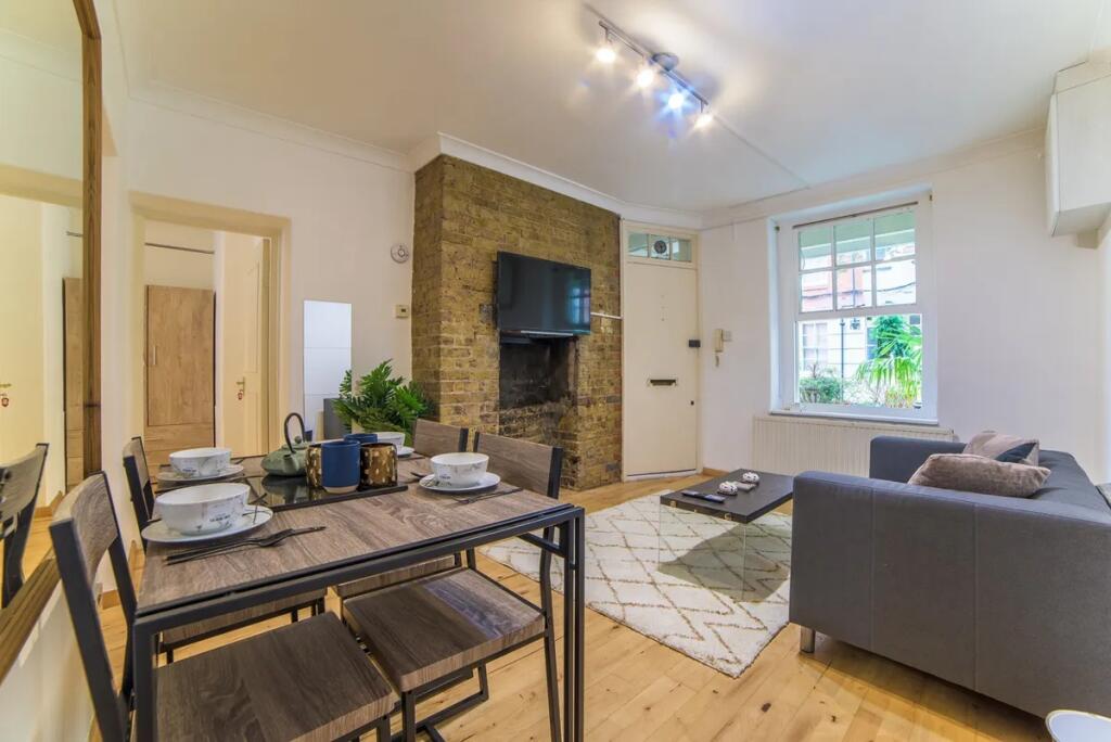 A cozy and modern living room featuring a styli...