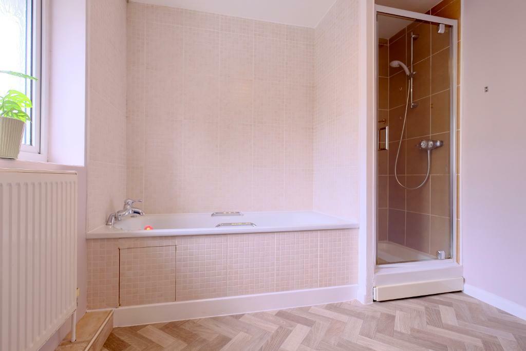 Bathroom with enclosed shower