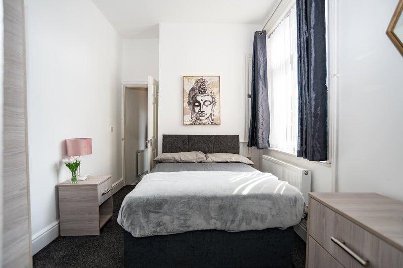 Bright and inviting double bedroom featuring a ...